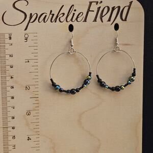 Iridescent black beaded hoop earrings